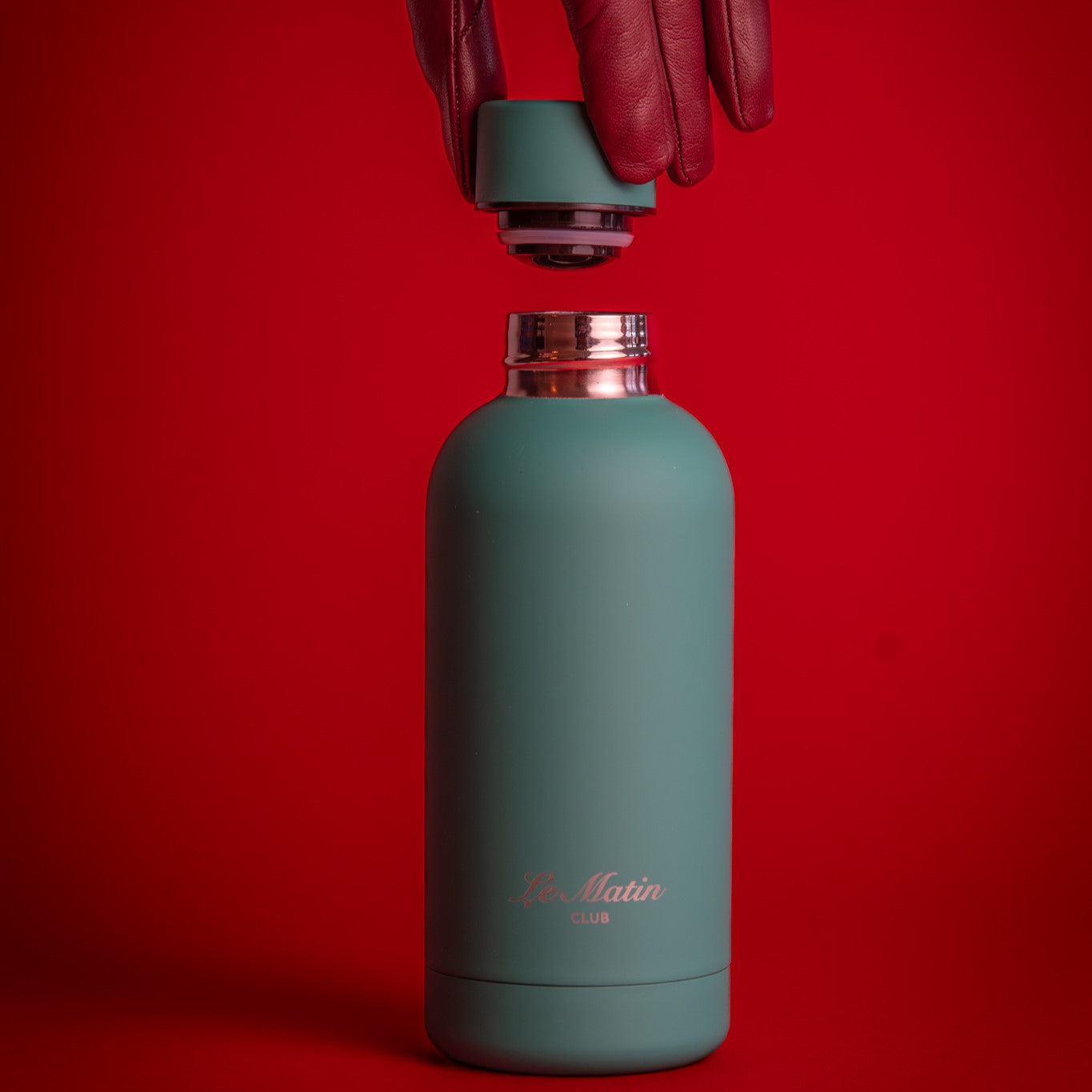 Green bottle on the background with cap inscrewed